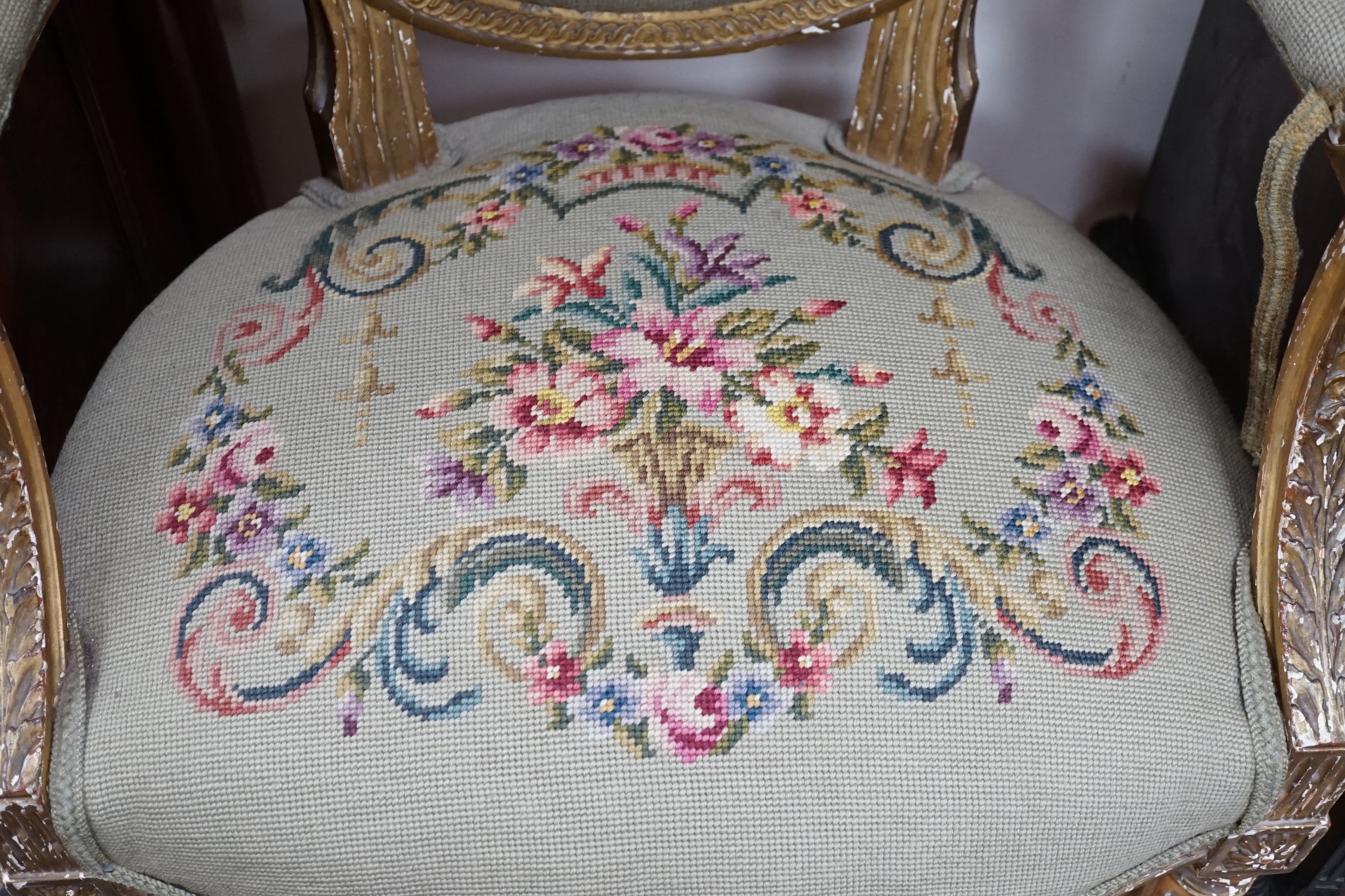 A 19th century French giltwood and composition fauteuil with tapestry upholstery, width 59cm, depth 46cm, height 90cm